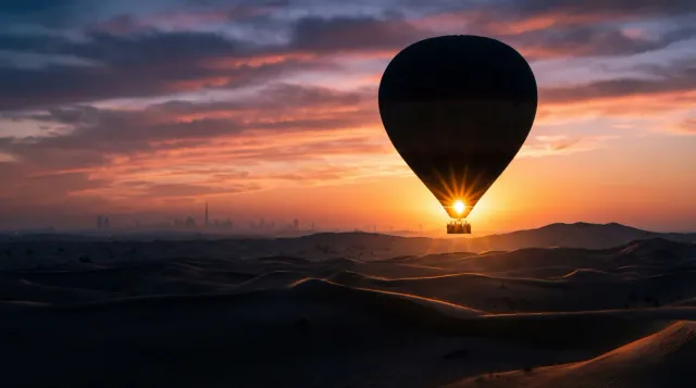 Balloon silhouette against a golden sky
