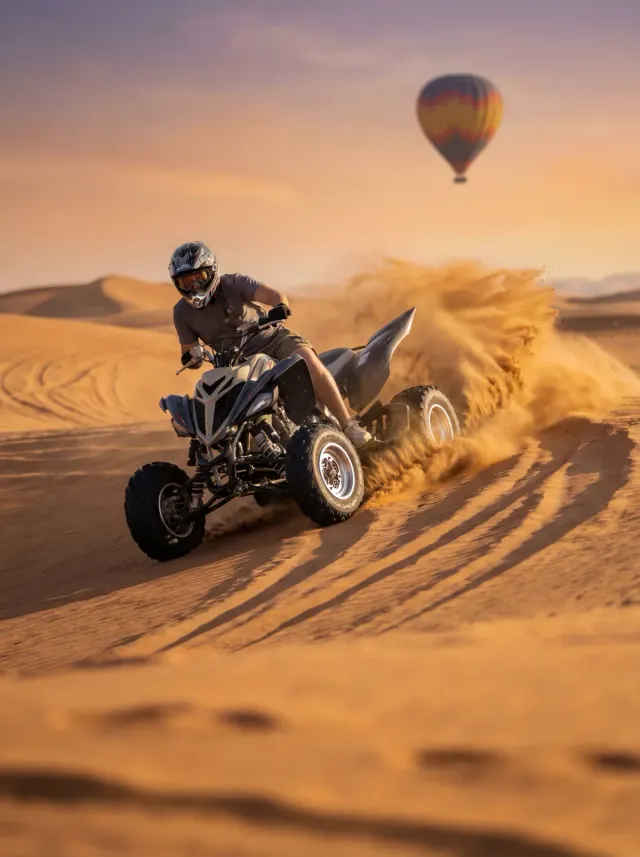 Quad biking across the dunes on the Adventure package