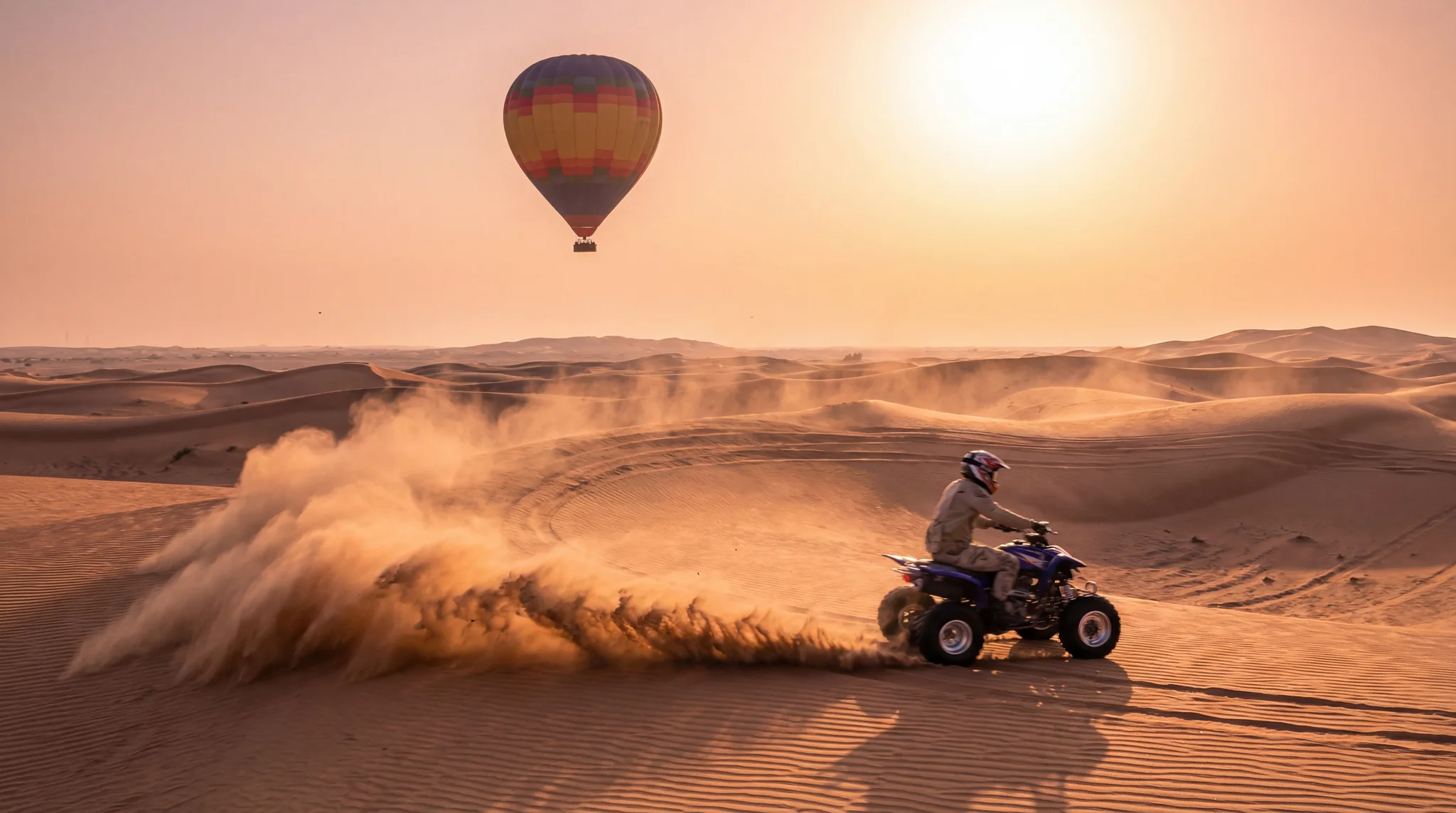Adventure hot air balloon Dubai with quad bike racing across desert dunes at sunrise