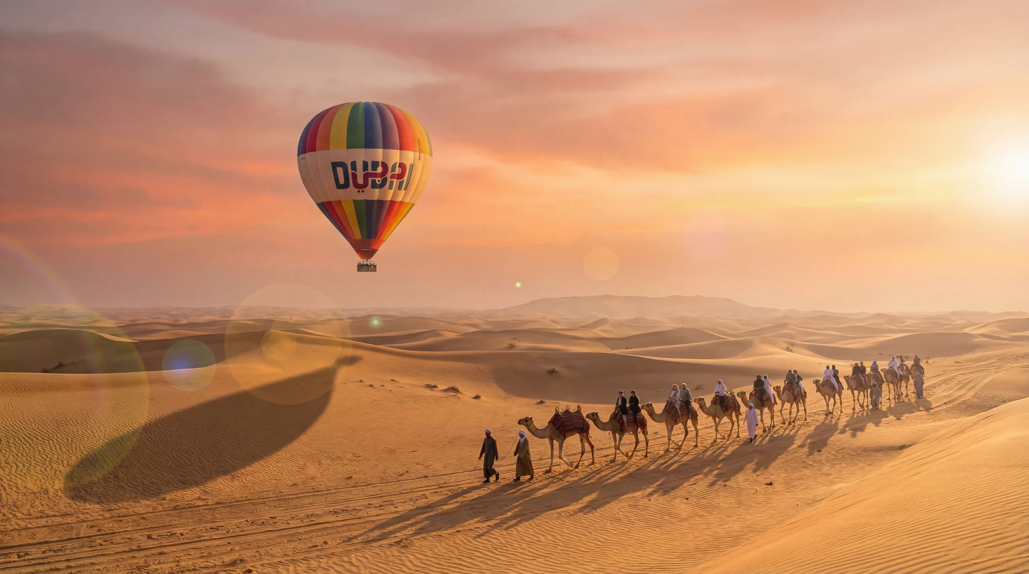 Deluxe hot air balloon Dubai flight over desert with camel caravan at sunrise